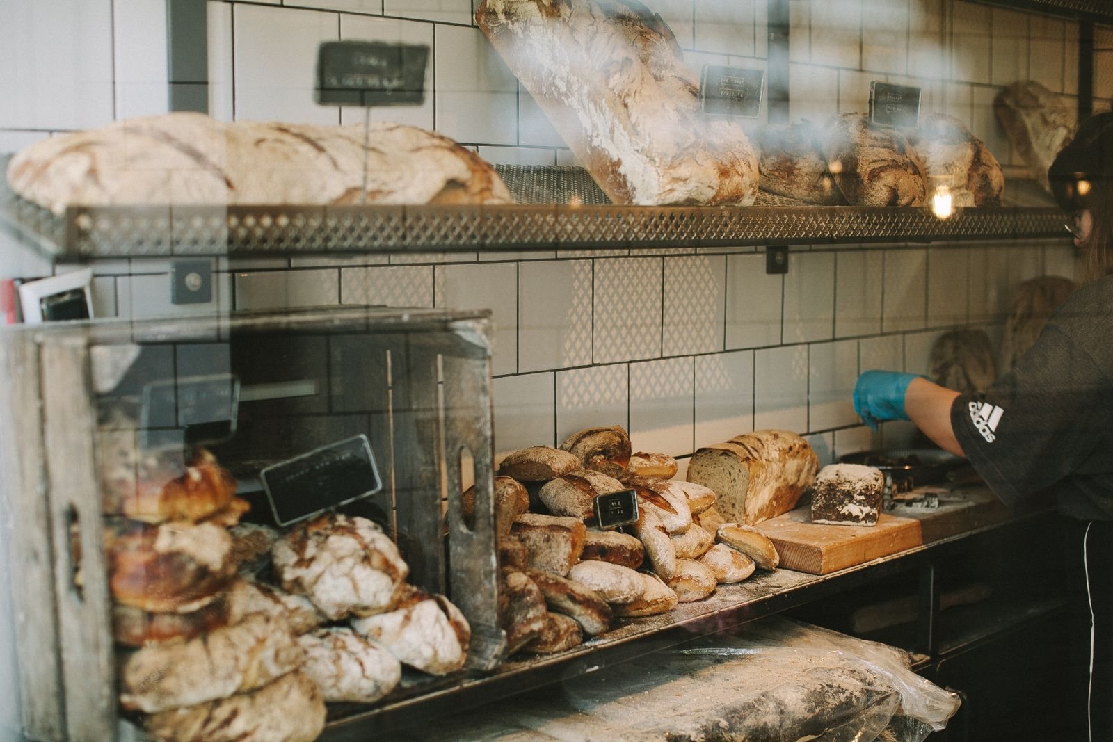 Fresh bread and pastries displayed in a bakery.